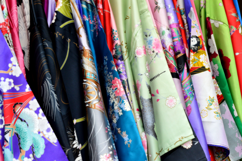 A close-up of a traditional Japanese kimono featuring detailed patterns and vibrant colors.