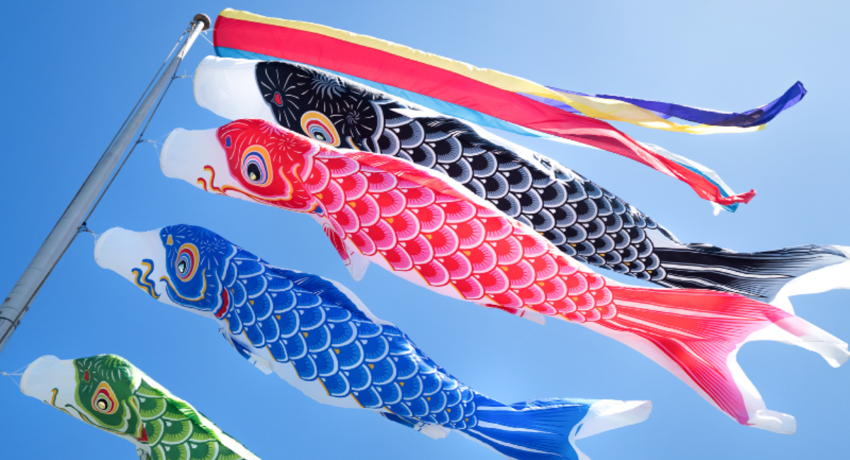 Colorful koinobori (carp streamers) flying in the blue sky, a traditional decoration for Japan’s Children’s Day.