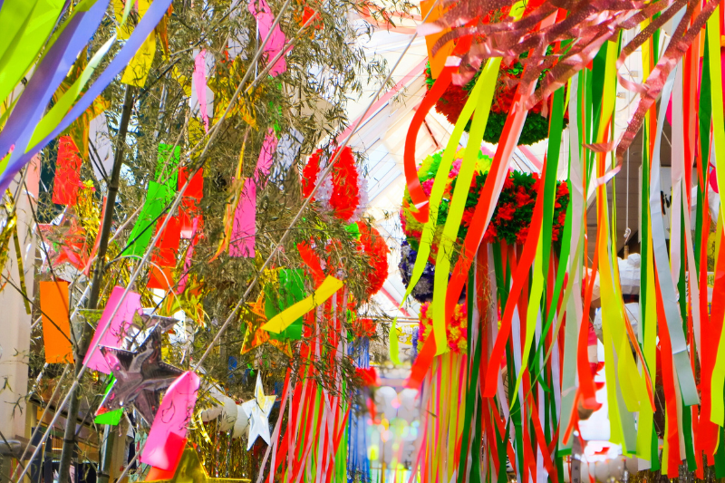 Colorful Tanabata streamers and ornaments hanging indoors, creating a festive summer atmosphere