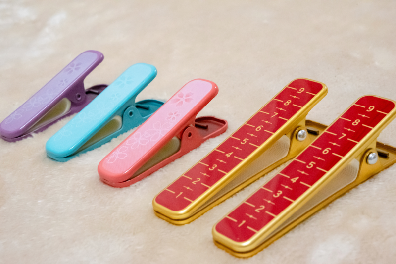 Kimono clip used to hold fabric during dressing